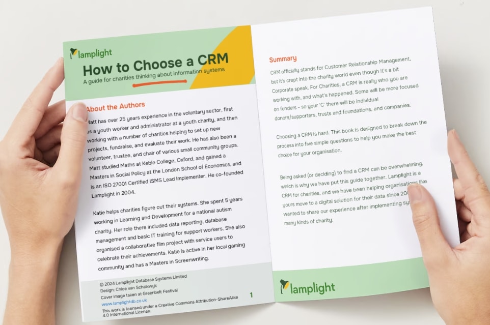 Picture of the How To Choose A Charity CRM book, held in hands